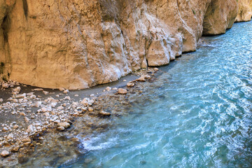 Saklikent Canyon in Turkey with mountain cold stormy water in the river. Natural attraction, popular place for tourists
