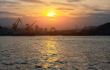 Scenic view of a sunset over the sea on a construction site background