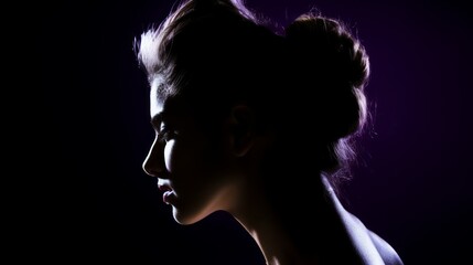 Fototapeta premium Close up portrait, silhouette of a woman on black background with copy space