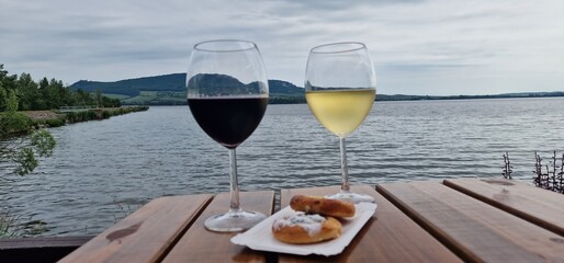  glass of white wine on the bank of nove mlyny reservoir