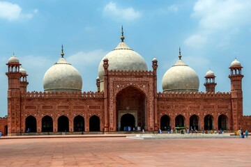 Badshahi Mosque in Lahore, Pakistan against a blue sky