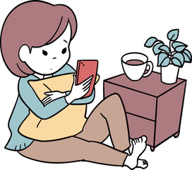 クッションを抱えて暇そうにスマホを眺める女の子