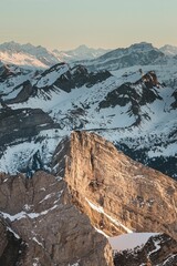 Vertical shot of the Swiss Alps. Beautiful snowy range.