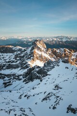 Vertical shot of the Swiss Alps. Beautiful snowy range.