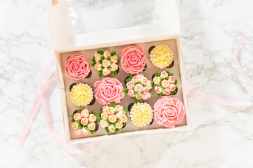 Delicious Gourmet Cupcakes Topped with Buttercream Frosting Flowers