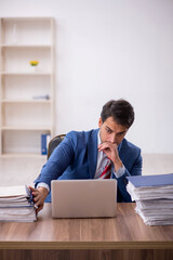 Young male employee working in the office