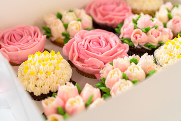 Delicious Gourmet Cupcakes Topped with Buttercream Frosting Flowers