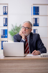 Old male employee and too much work in the office