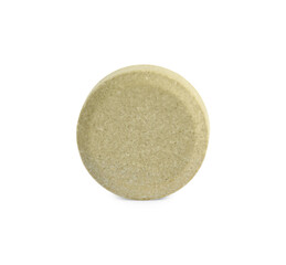 One round pill on white background. Medicinal treatment