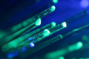 Optical fiber strands transmitting different color lights, macro view