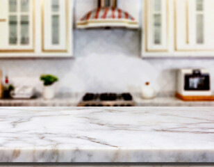 Selective focus,Marble table top on blur white kitchen room background.