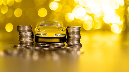 Car model crashed into coin stack