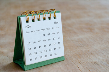 May 2024 table calendar with customizable space for text. Calendar and copy space concepts