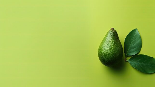 Fresh Cut Avocado Seed from above on a light green