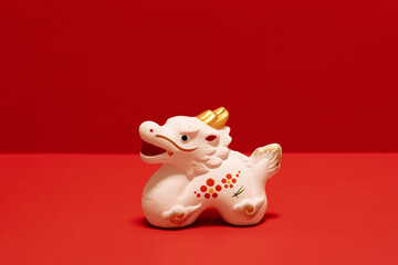 Japanese new year material. Zodiac dragon on red background. 日本のお正月素材。赤色背景上の干支の辰。