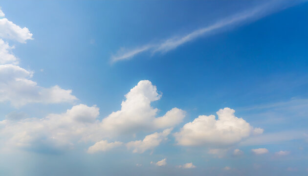 Background picture low angle of bright blue sky on a sunny day. There are fluffy white clouds and clear in soft tones. Feeling fresh, calm, and relax. Idea for heaven wallpaper with copy space