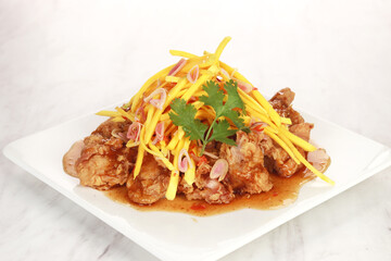 the menu of a restaurant called Mango Chicken. Flour fried chicken with spices and mango