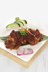 delicious Grilled Ribs called Iga Bakar Madu in Indonesian isolated on a white background