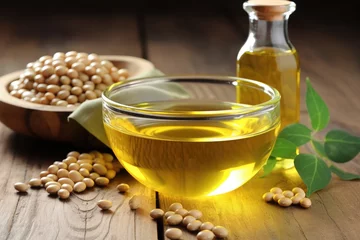 Fotobehang Soybean oil in glass bowl on wooden table © The Big L