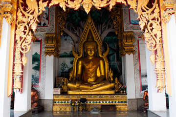 Fototapeta na wymiar Ancient buddha statue in antique ubosot for thai people travel visit respect praying blessing wish holy mystery at Wat Khao Phra Si Sanphet Chayaram temple on November 7, 2023 in Suphan Buri, Thailand