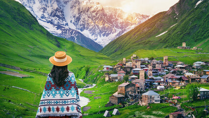 Tourist enjoy view of Ushguli village in Georgia. - obrazy, fototapety, plakaty