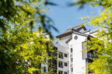 Obraz premium Modern apartment buildings with Chinese style rooftops