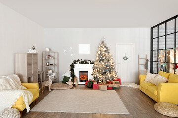 Interior of living room with Christmas tree, sofa, armchair, fireplace and dining table