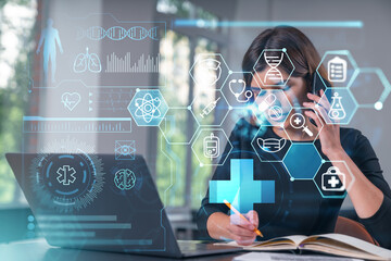 Pensive attractive beautiful businesswoman working on laptop, talking on phone at office workplace in background. Flying medical icons. Concept of health care and insurance.