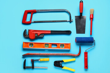 Set of construction tools on blue background