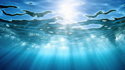 Fototapeta na wymiar Underwater scene with sun rays and blue water surface. High quality photo