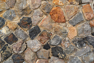 hard stones stack or modern rock wall dam and brown gray granite floor or black yellow stone jigsaw with concrete on top view for strong background or texture wallpaper with architecture construction