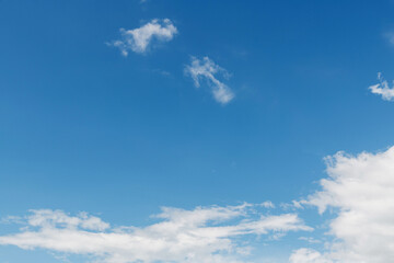 Naklejka na ściany i meble Wispy clouds in the blue sky