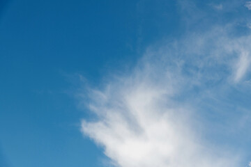 Wispy clouds in the blue sky