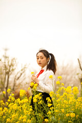 woman in a field of yellow flowers