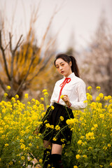 woman in a field of yellow flowers