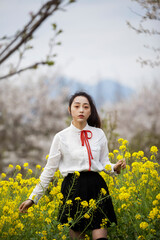 woman in a field of yellow flowers