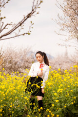 Fototapeta premium woman in a field of yellow flowers