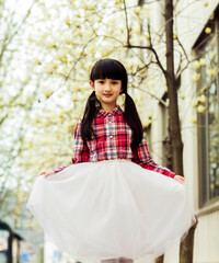 Fototapeta premium girl in a cherry blossom