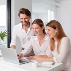 Fototapeta premium colleagues a man and two women discussing a new project while looking at a laptop