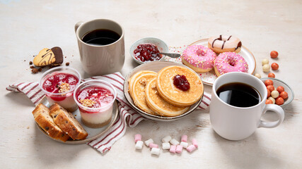 Delicious american dessert table with coffee.