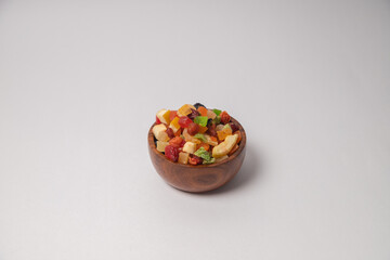Mixed dry fruits on white bowl with white background, Mixed dried fruits on glass bowl with white background