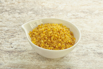 Raw bulgur in the bowl