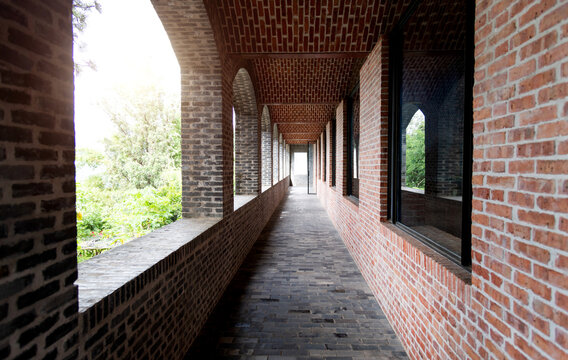 Long corridor of red brick house