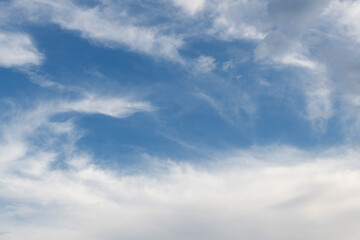 Wispy clouds in the blue sky
