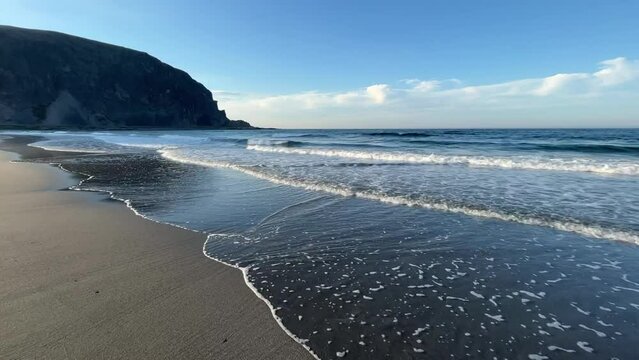 Beautiful Sunny Summer day at the Shores of the Barents Sea, Small waves rolling in