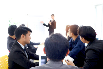 Fototapeta premium Businesspeople discussing at conference office desk, businesspeople listening to presentation, brainstorming at group board meeting, people reached agreement deal, successful company teamwork meeting.