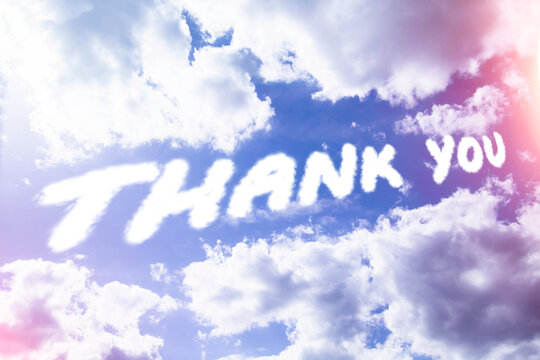 Thank you. Text from clouds in sky in bright sunlight.