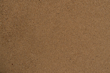 Texture of wet sand on a beach top view