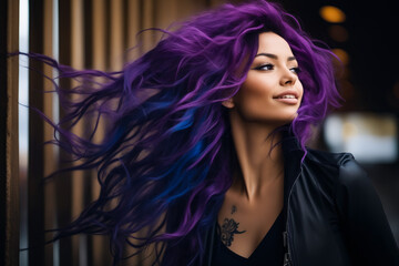Woman with purple hair and black jacket on.