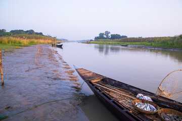 landscape view of Traditional wooden fishing boats on the shore of the Padma River in Bangladesh